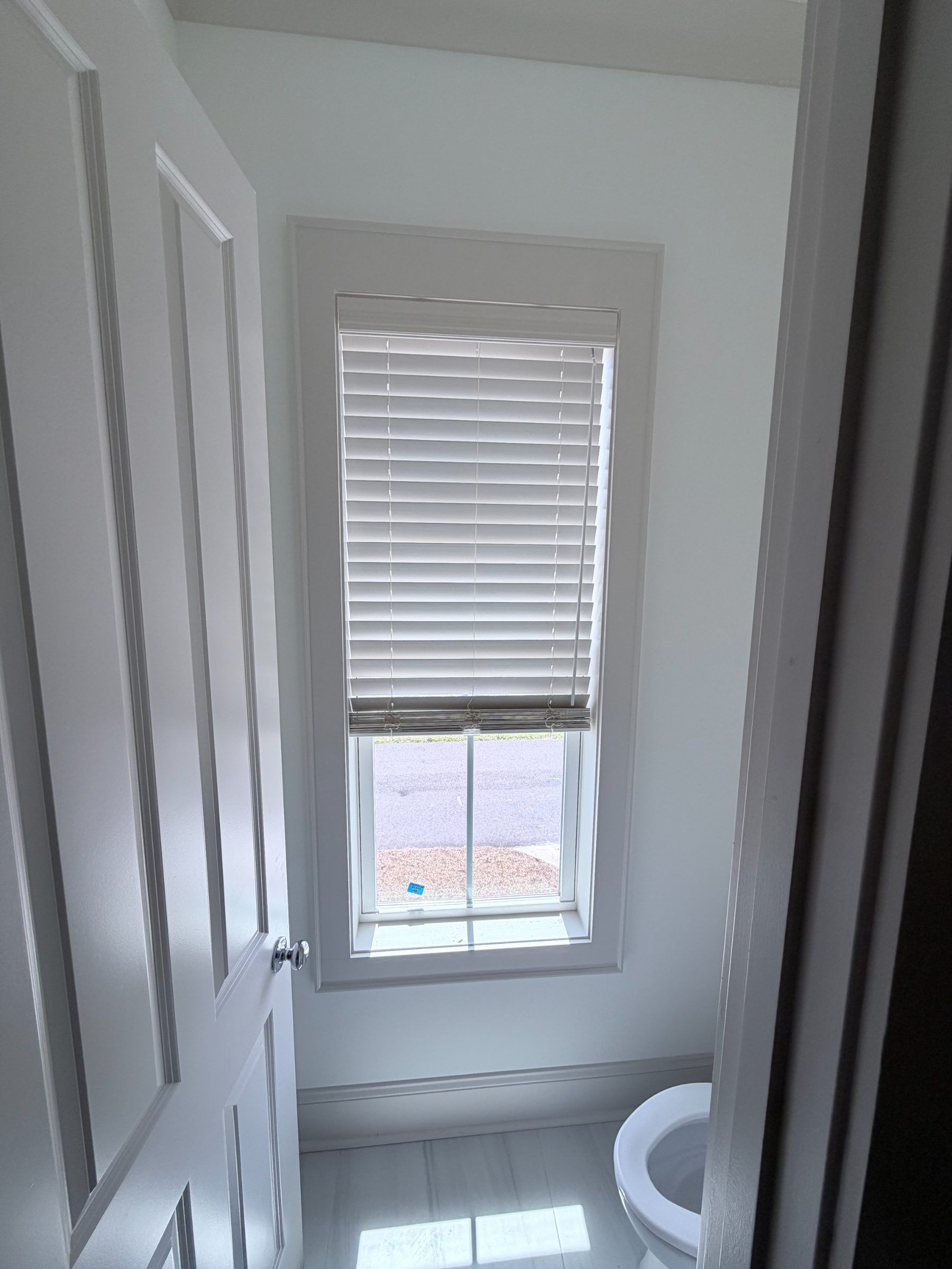 Faux wood blinds in a bathroom