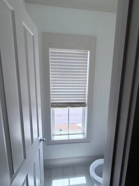 Faux wood blinds in a bathroom