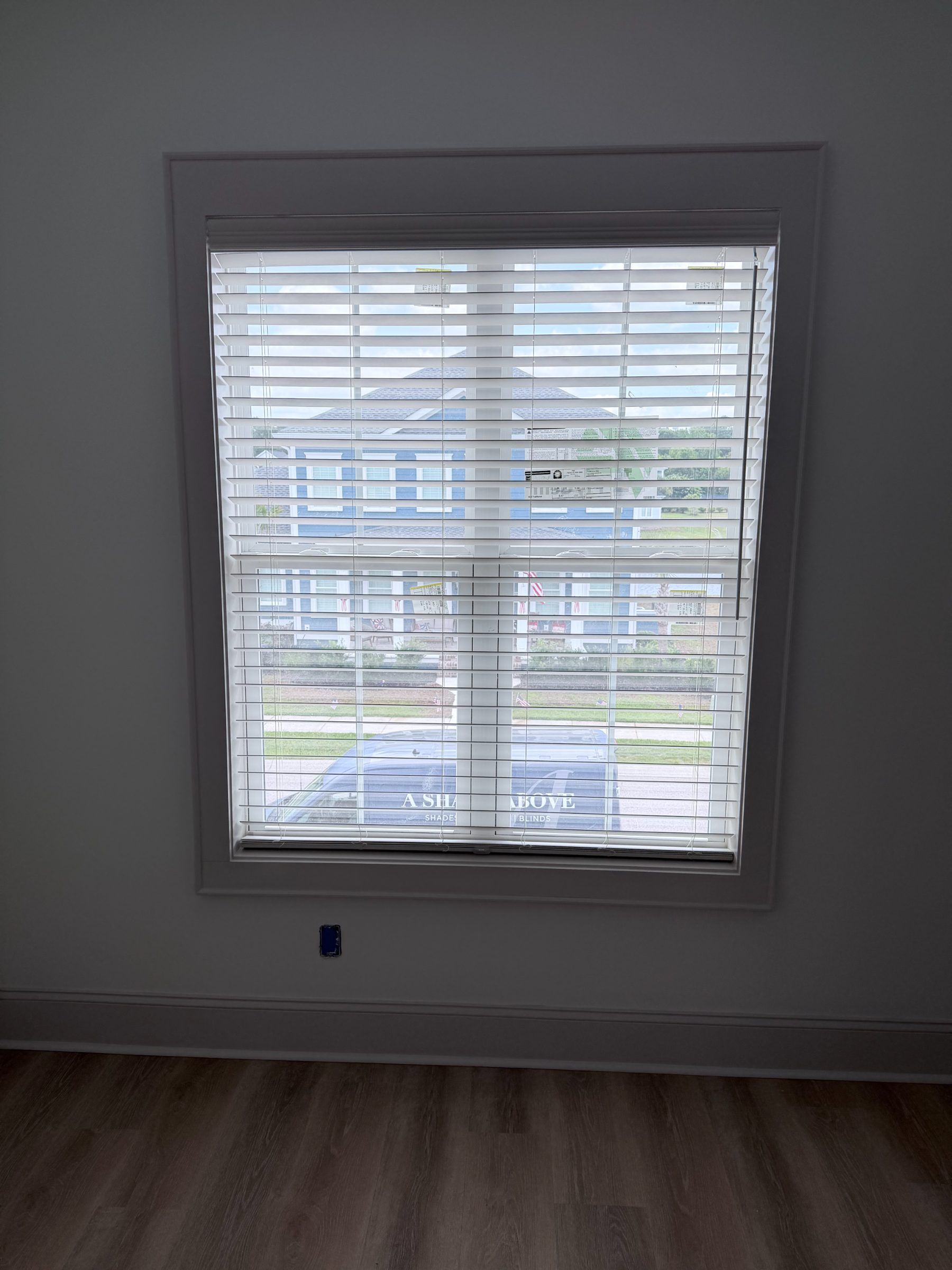Faux wood blinds with slats open