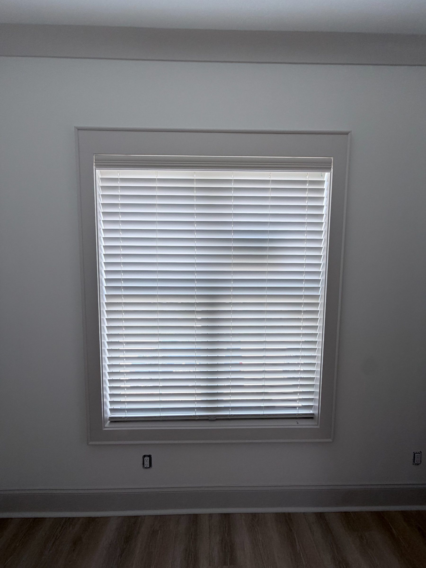 Faux wood blinds with slats closed