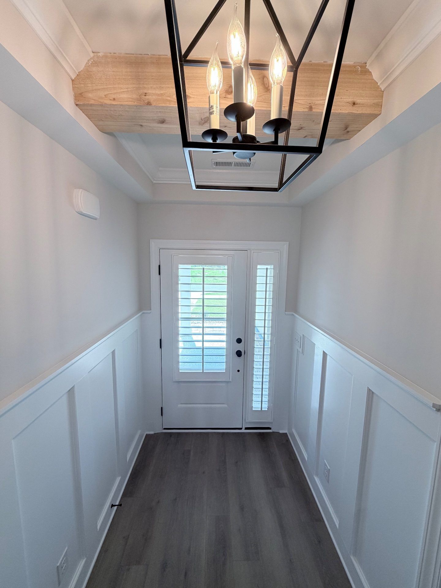 Plantation shutters on a Front Door and Sidelite