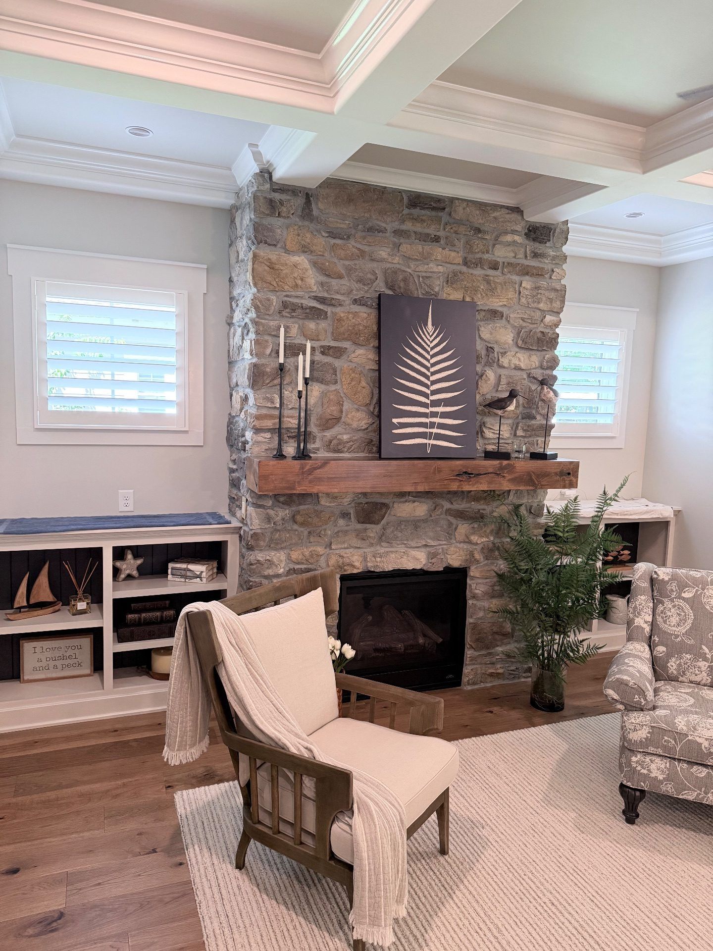 Plantation shutters next to a fireplace