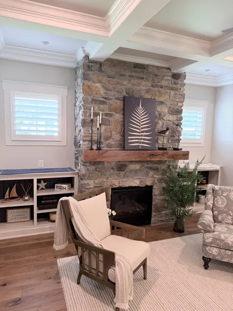 Plantation shutters next to a fireplace