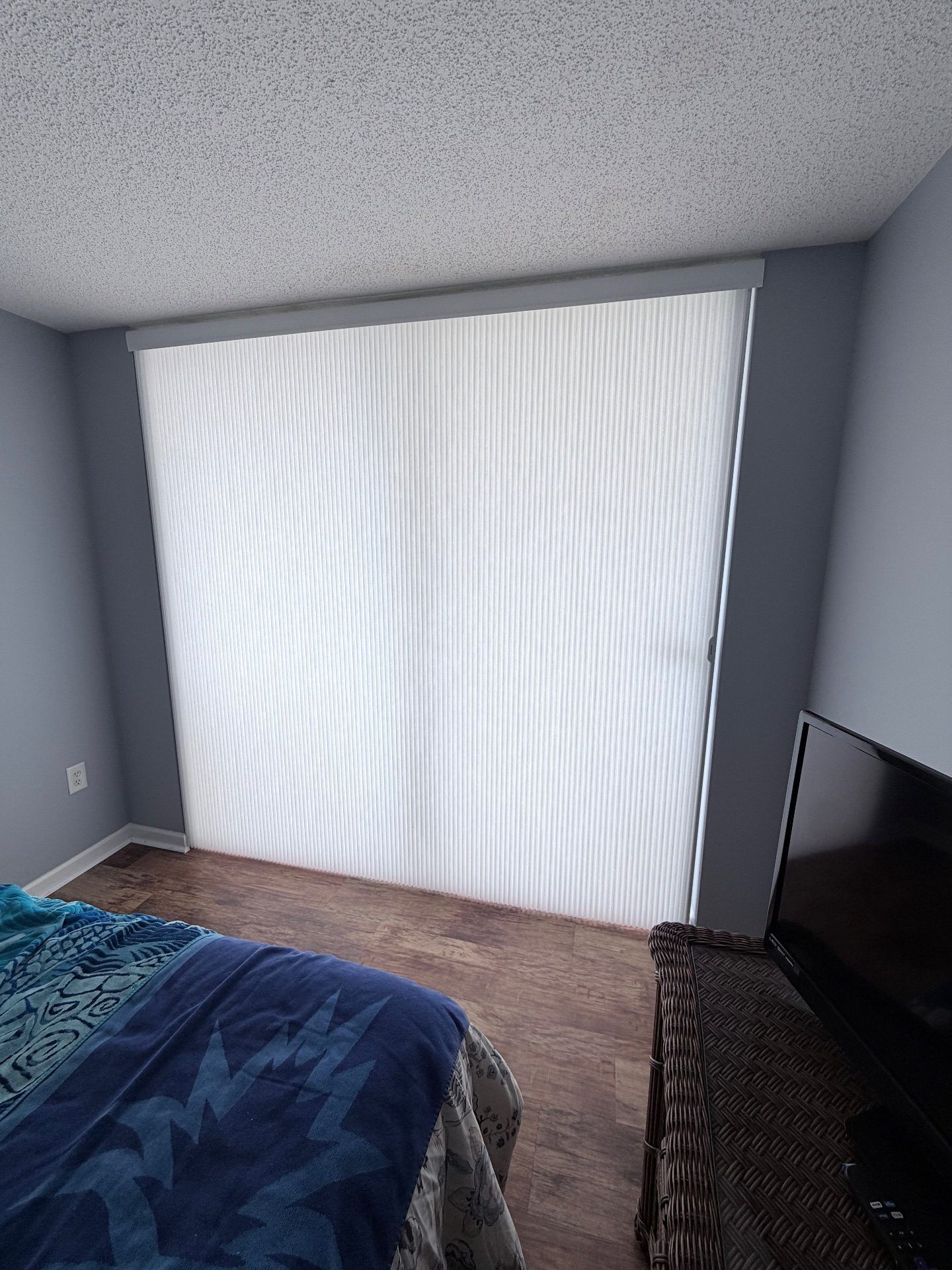 Applause Honeycomb Vertiglide over a Sliding Glass Door in a Condo (Shown closed)