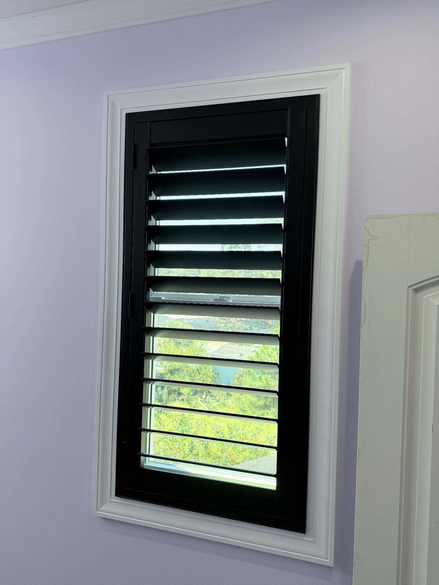 Black trimmed plantation shutters