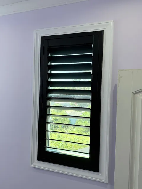 Black trimmed plantation shutters