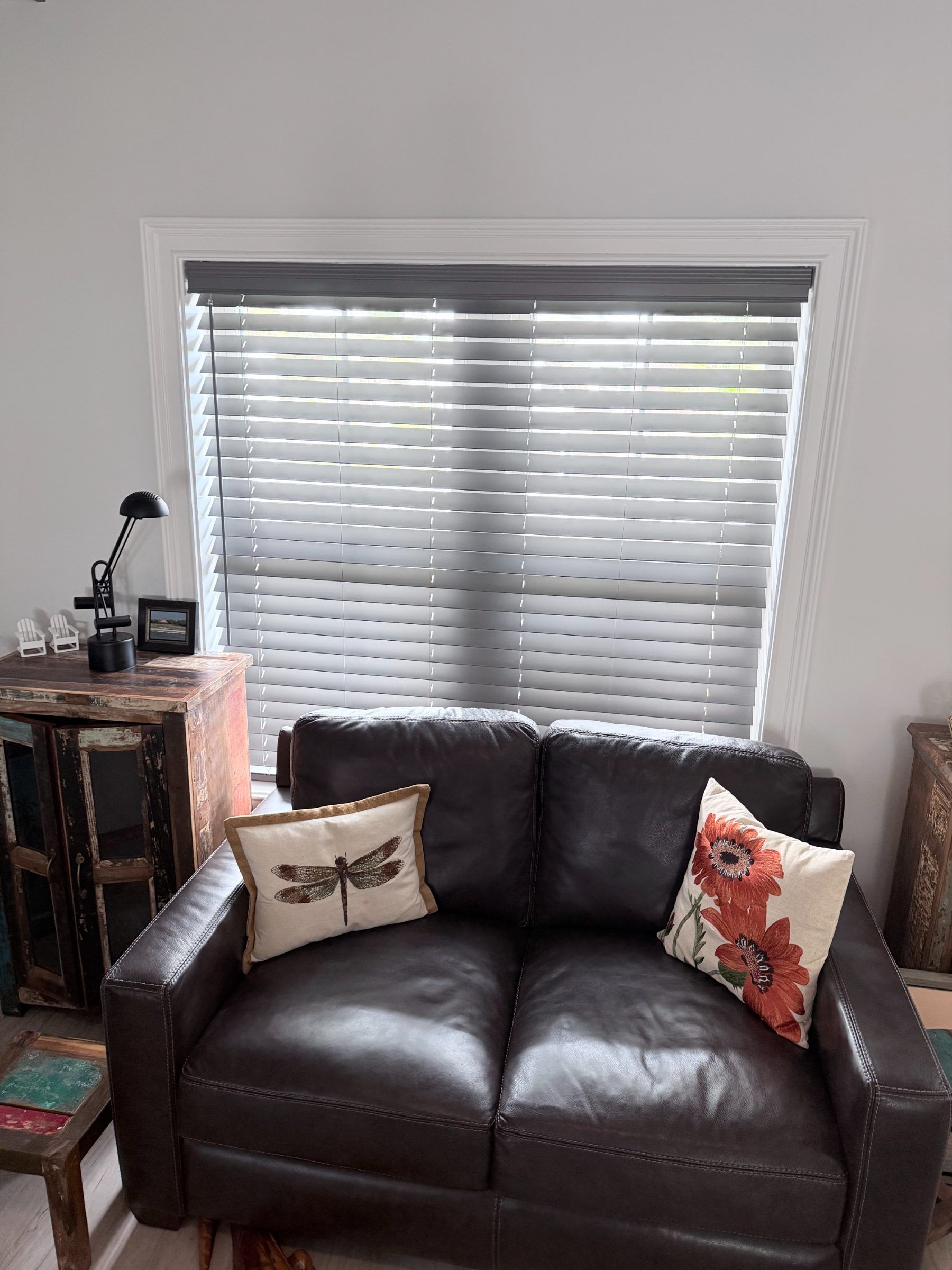Cordless Gray Faux Wood Blinds in a Living Area
