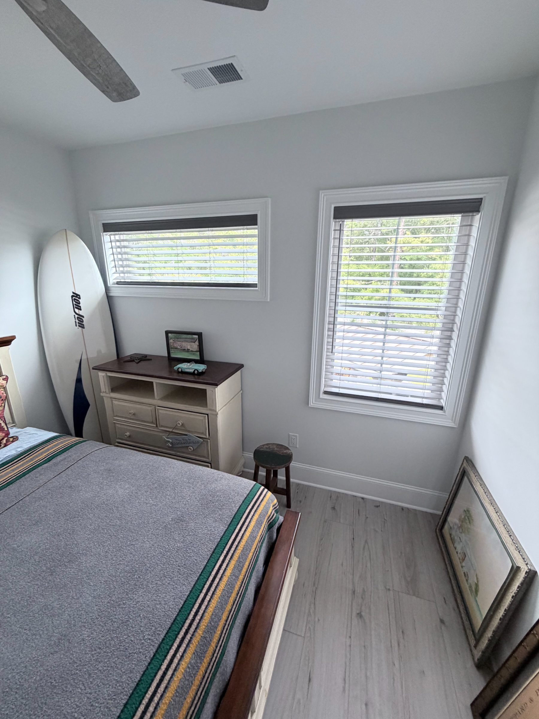 Cordless Gray Faux Wood Blinds in a Bedroom