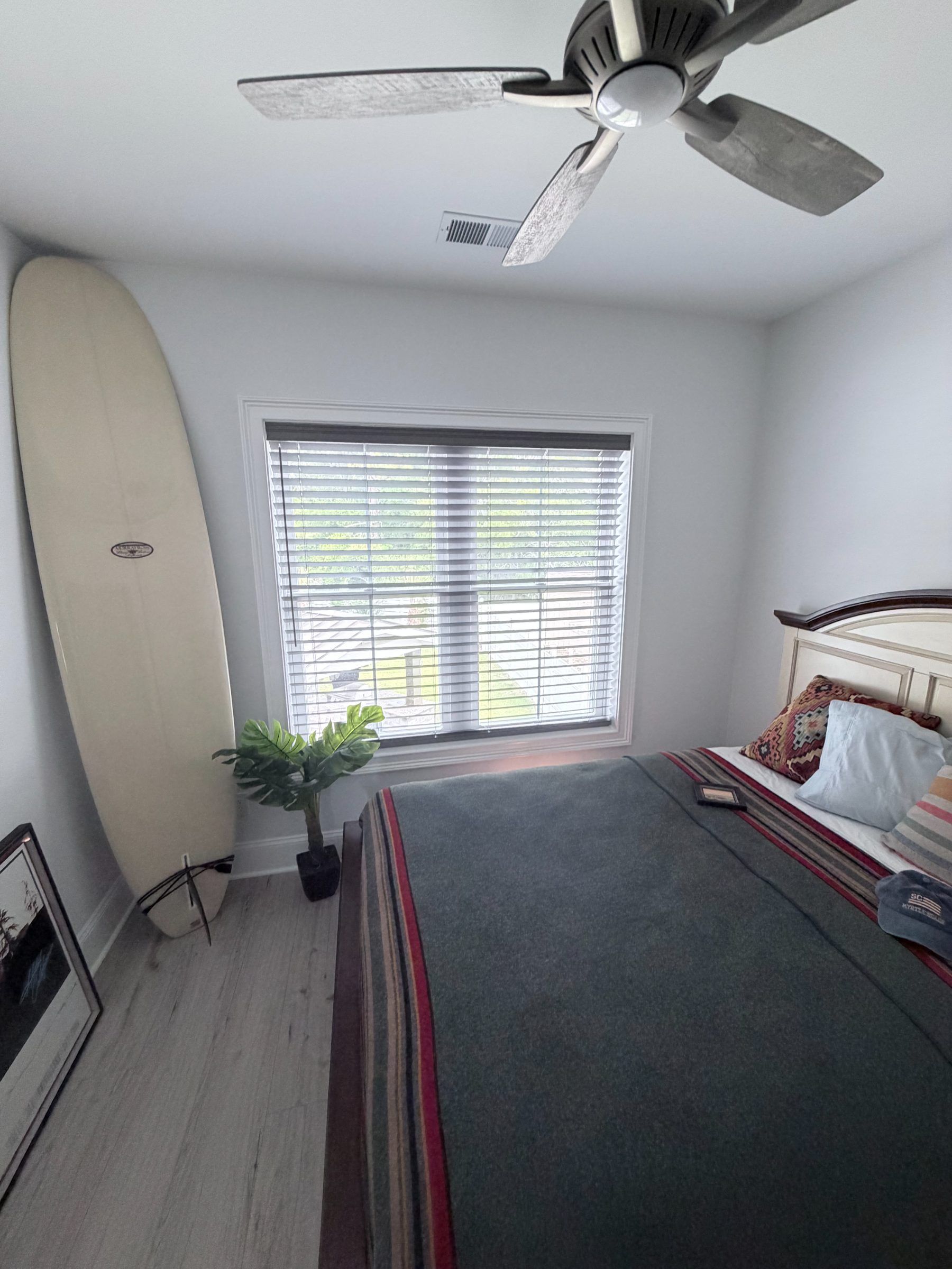 Cordless Gray Faux Wood Blinds in a Bedroom