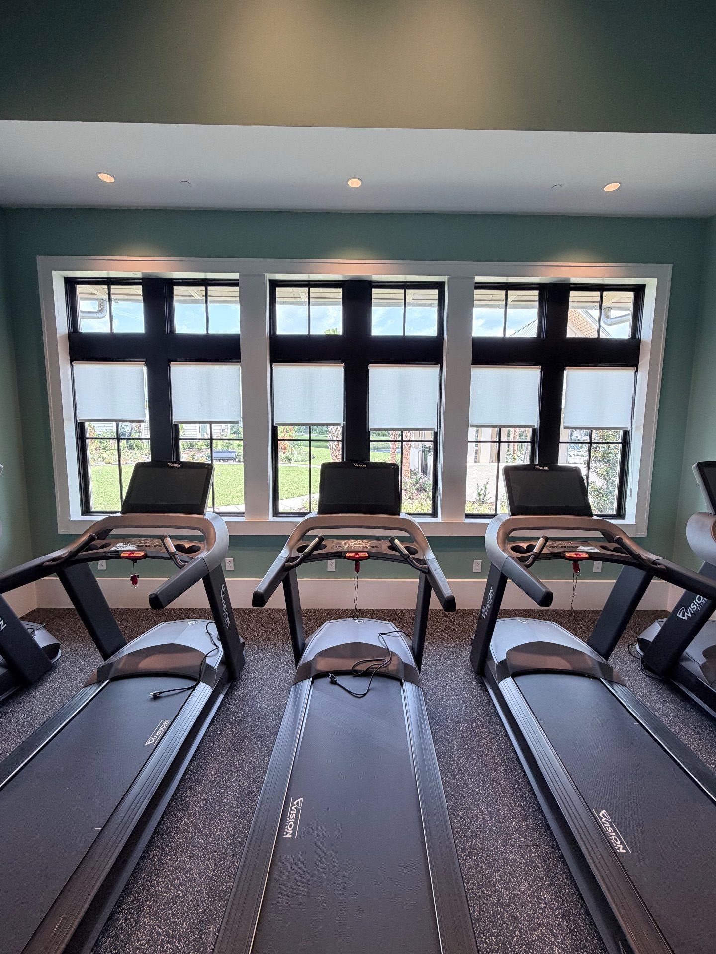 Open roll roller shades in Grande Dunes North Gym Facility
