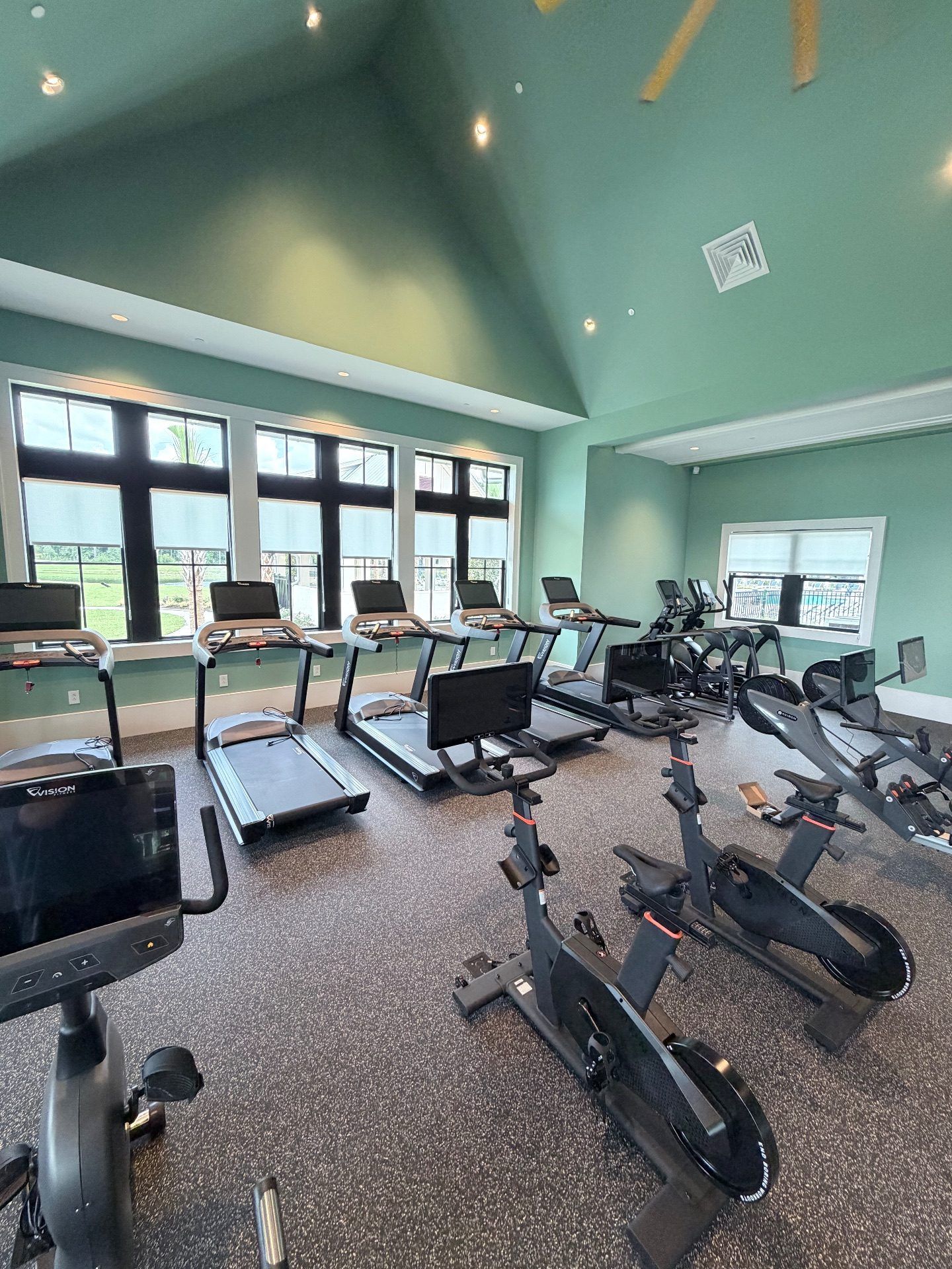 Open roll roller shades in Grande Dunes North Gym Facility