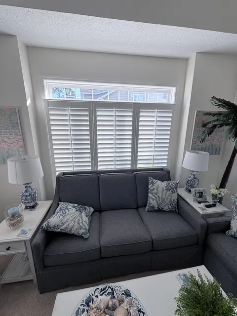 Plantation Shutters with Split Tilt in a Coastal Living Room