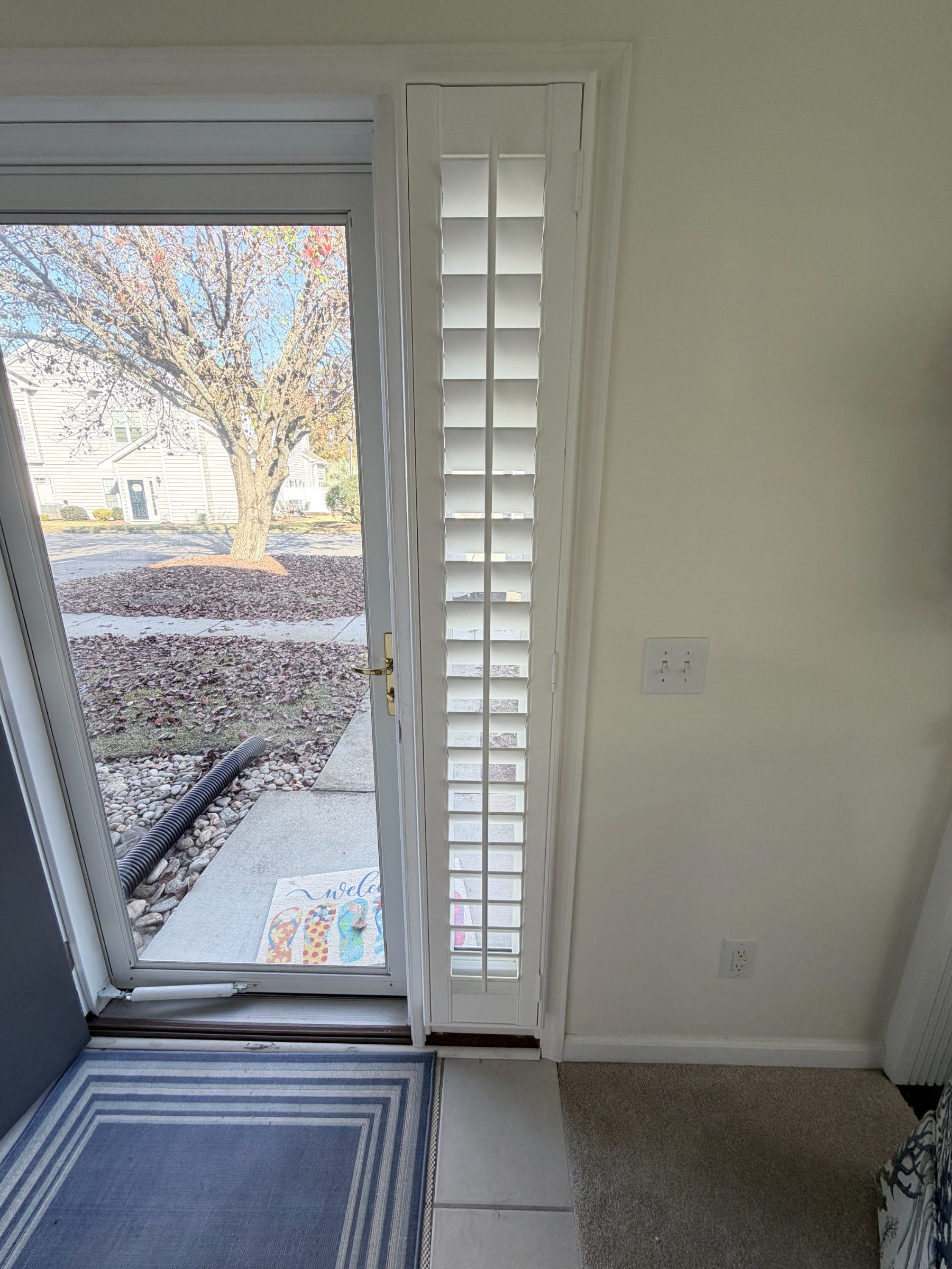 Plantation Shutters with Split Tilt on a Door Sidelite