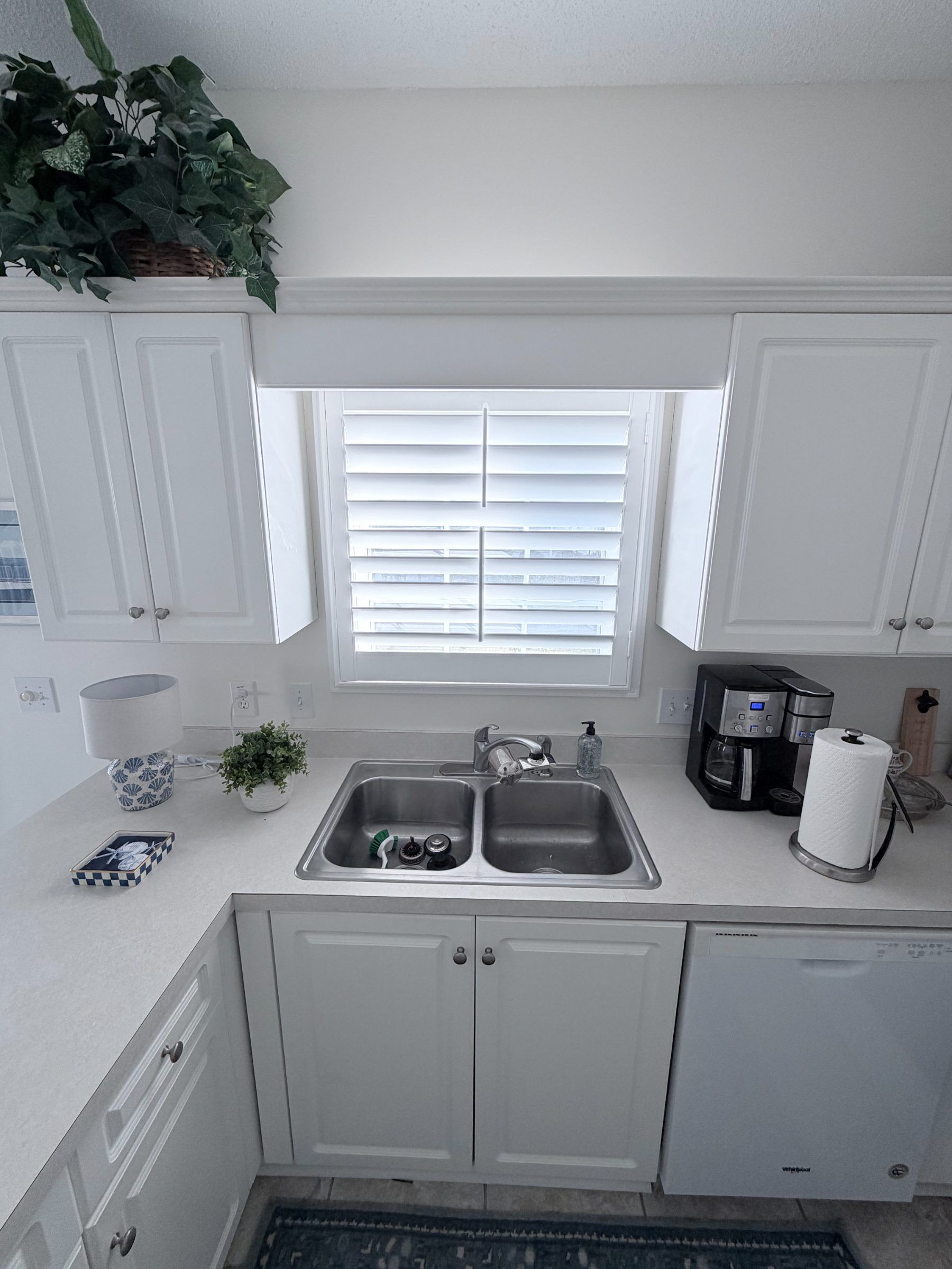 Plantation Shutters with Split Tilt above a Kitchen Sink