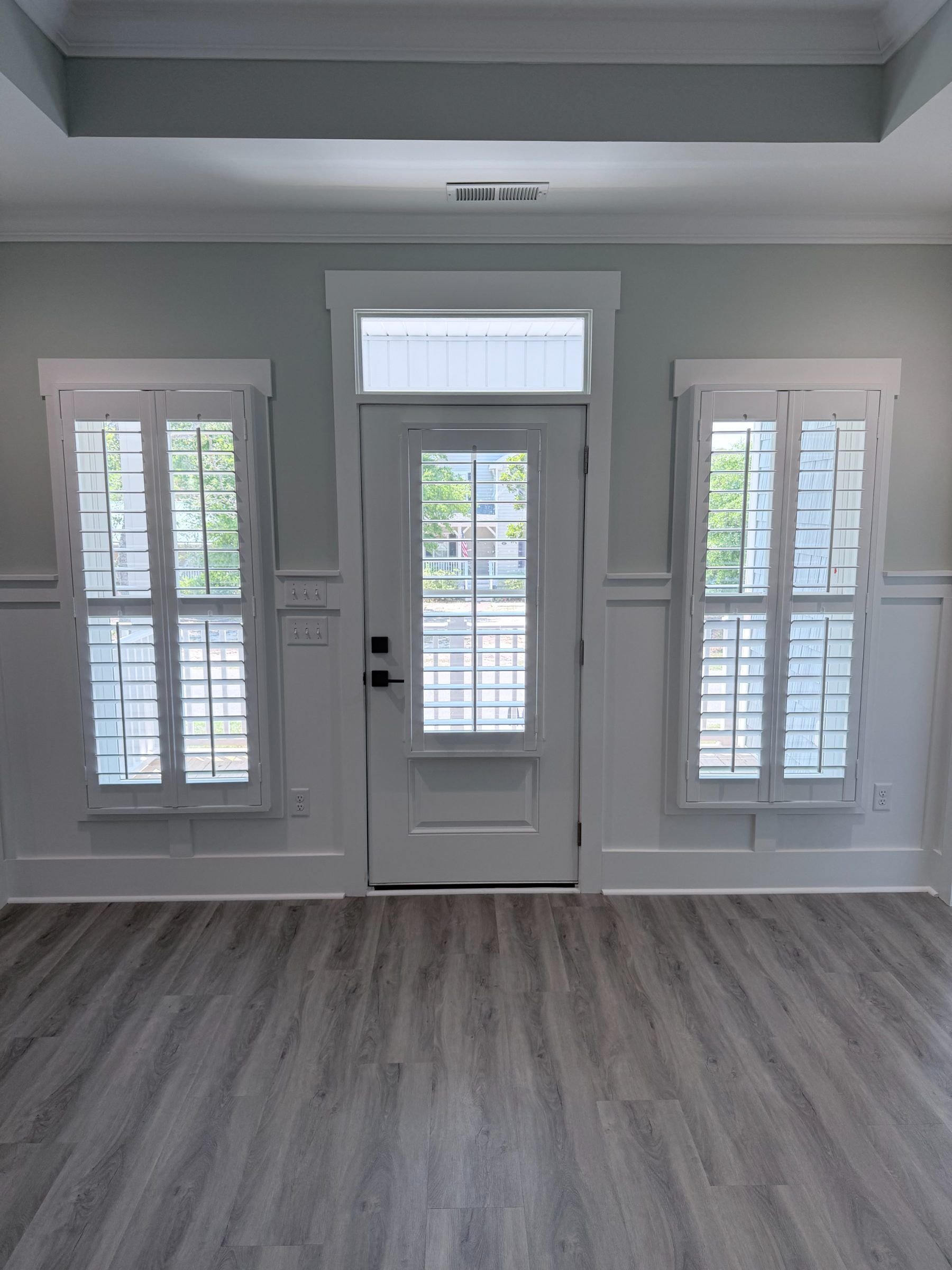 Center Open Plantation Shutters with Divider Rail on Door
