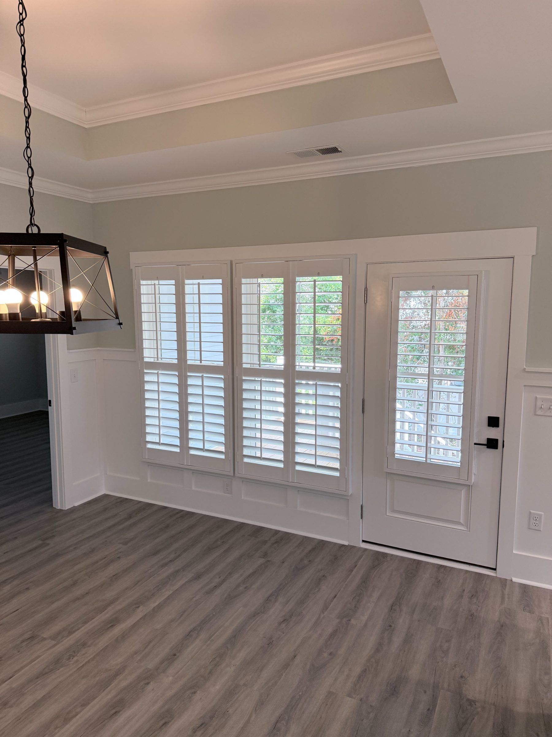 Four Panel Center Open Plantation Shutters in a dining room