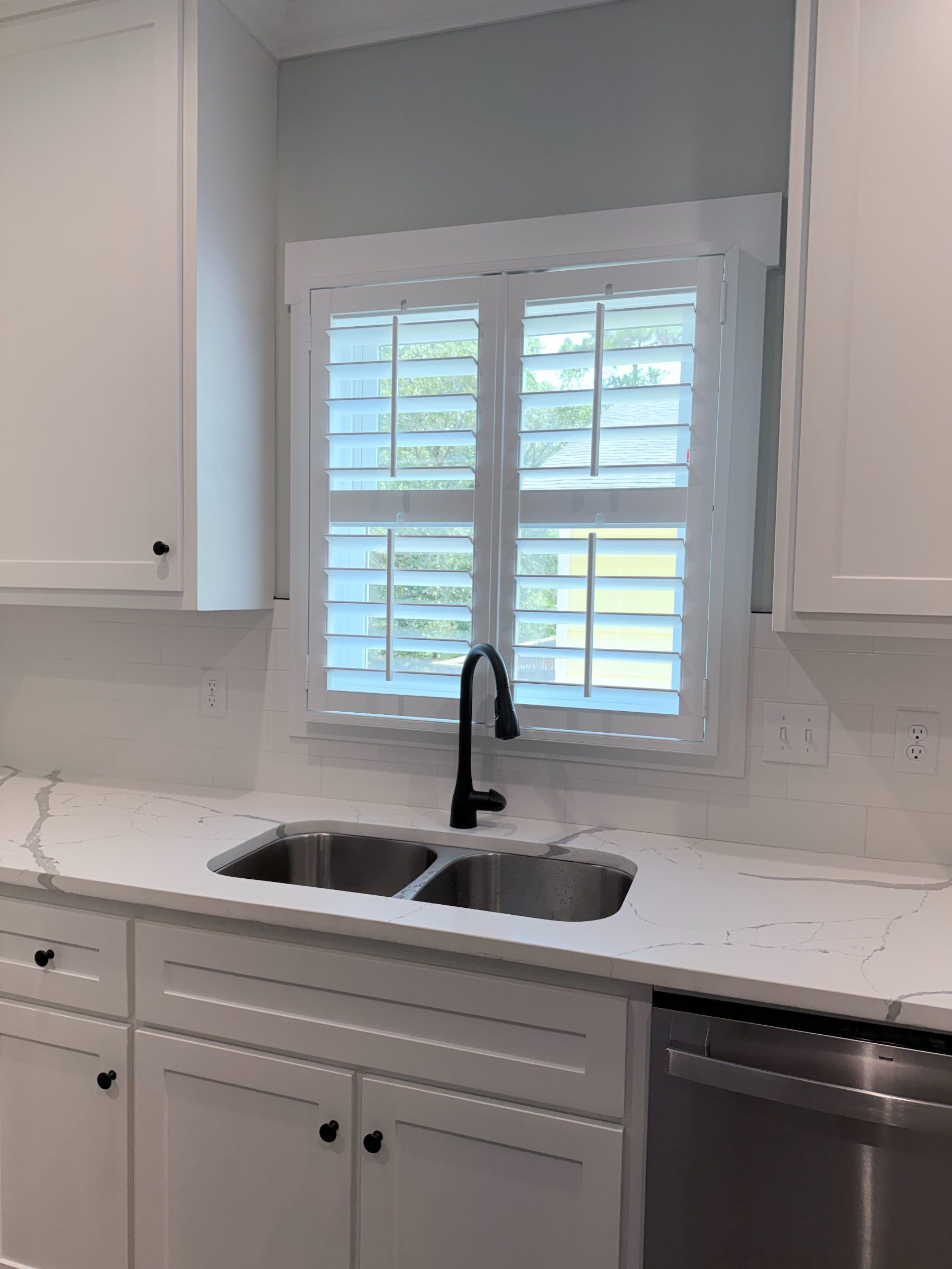 Plantation Shutters over a Kitchen Sink