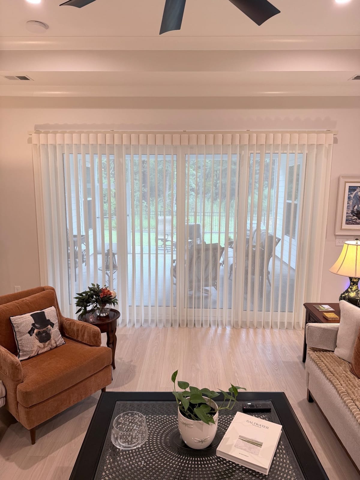 A Smart Drape across a wide sliding glass door in a living room at Ocean Isle Palms, Shallotte.